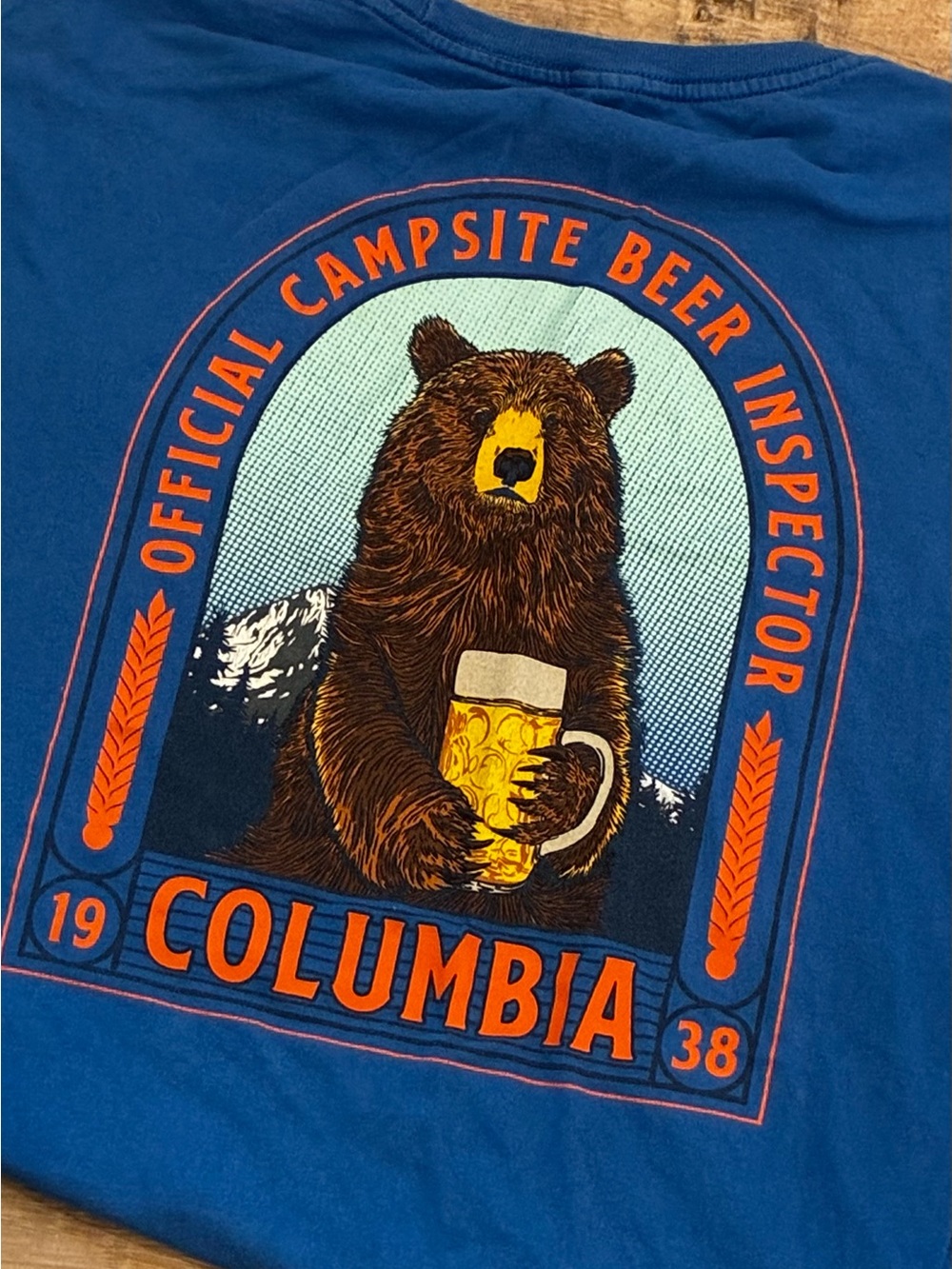 Columbia Blue Graphic Tee with Brown Bear and Orange Accents